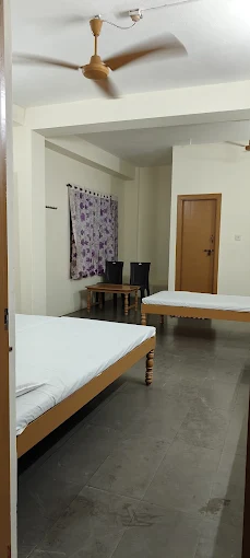 Double bedded room with 2 beds at Hotel Bhavani Udupi
